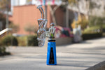 Blue Epro concentrate vaporizer with classic glass sitting in the sun